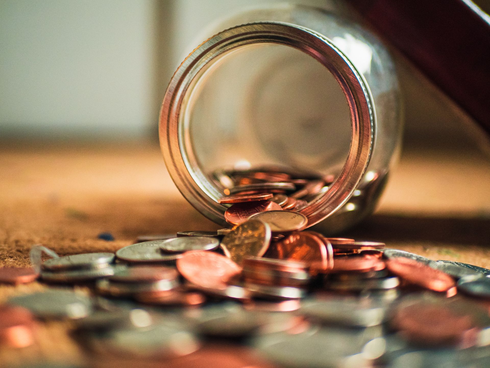 coins spilling from a jar representing an award for spousal support