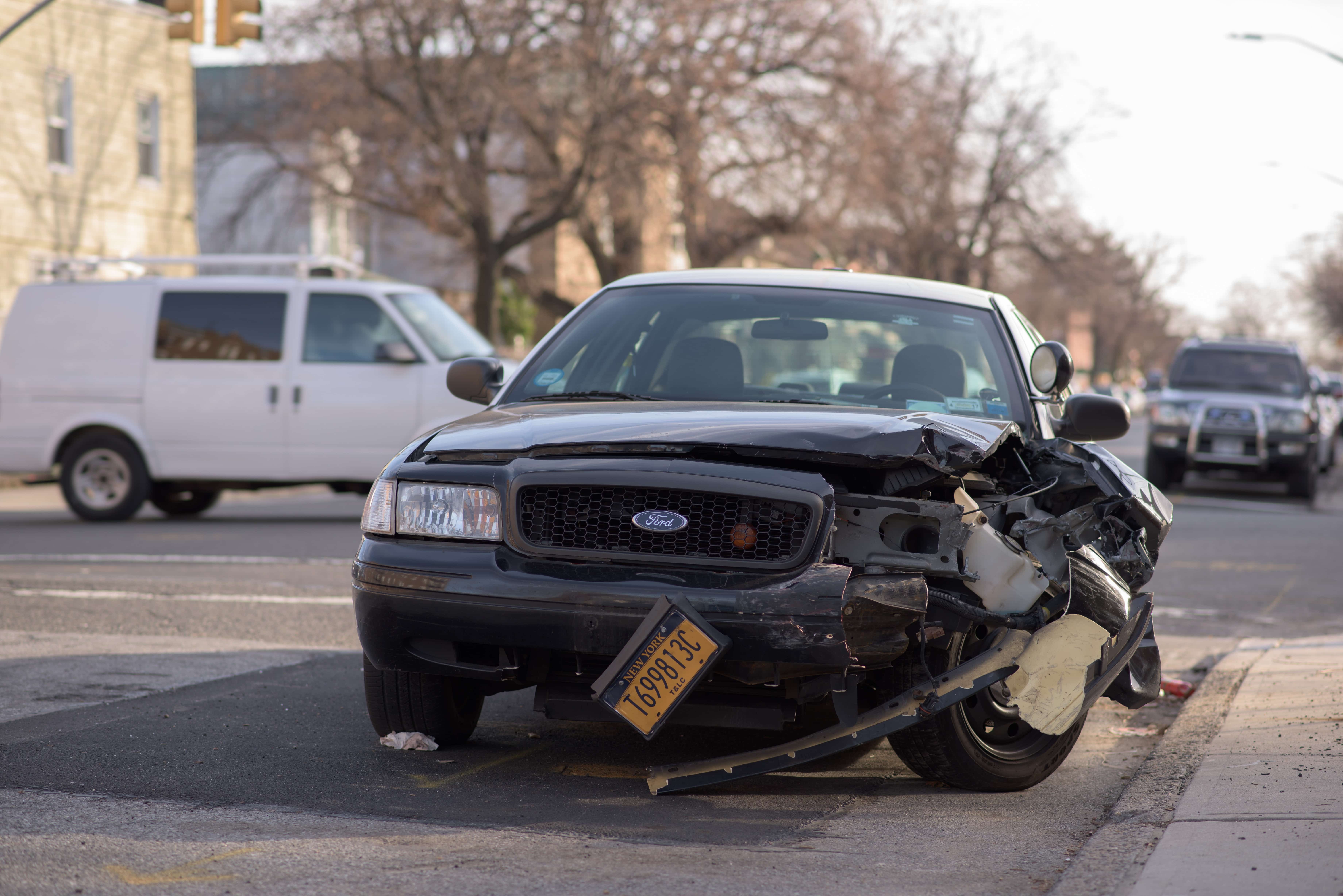 A damaged car, representing a personal injury settlement from a motor vehicle accident